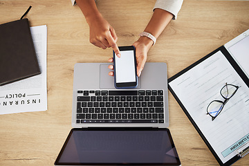 Image showing Person hands, blank phone screen and office with mockup space and insurance worker at desk. Mobile app, scroll and top view with web research and business work with data and digital paperwork