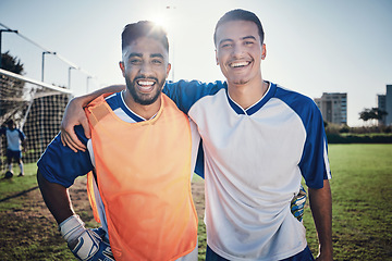 Image showing Happy soccer players, team or portrait of men on a field for sports game, practice or fitness training. People, wellness or excited athlete friends hug after a match with smile or support in stadium