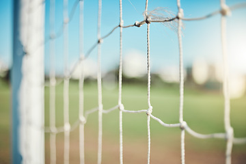 Image showing Empty, sports and goal post on soccer field for fitness training, exercise or workout outdoors. Football club, grass pitch background or closeup of blur net of game in competition or match contest