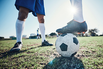 Image showing Legs, soccer and ball with players ready for kickoff on a sports field during a competitive game closeup. Football, fitness and teamwork on grass with a team standing in boots to start of a match