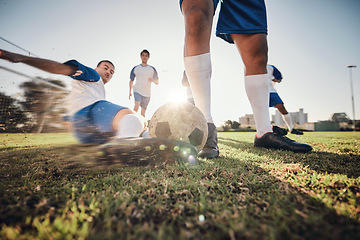 Image showing Closeup, ball and soccer with men, tackle and exercise with sports, competition and training. Zoom, football and healthy athletes with energy, fitness and teamwork for a match, action and blur motion