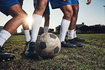 Image showing Closeup, ball and soccer with men, game and fitness with sports, competition and workout goals. Zoom, football and athletes with energy, exercise and training for a match, action and tackle challenge