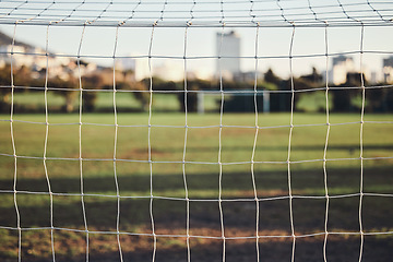 Image showing Empty, net or goal post on soccer field for fitness training, exercise or workout outdoors on grass pitch. Football club, background or closeup of game competition event or match contest in stadium