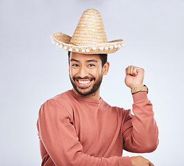 Image showing Sombrero, excited and portrait of man in studio with dance moves for comic, humor and funny joke. Happy, party accessories and face of male person on white background with Mexican hat for comedy