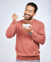 Image showing Health studio, happy man and eating salad, vegetables or green food meal for diet, healthy lunch or wellness nutrition. Nutritionist, lettuce bowl and hungry male vegetarian on white background