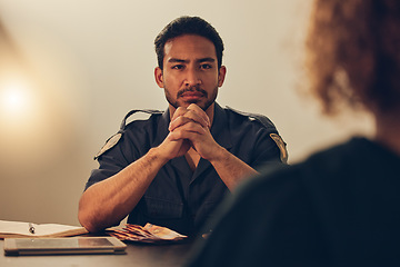 Image showing Police, investigation and man listening to woman for report, interrogation or criminal arrest. Law, crime and bribery, detective at station for money laundering interview, questions and attention.