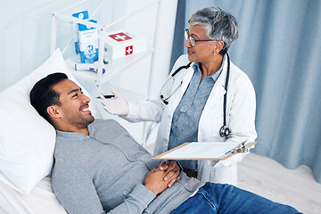 Image showing Man, doctor and medical test with talking and senior professional at a hospital for support. Wellness, consultation and patient at a clinic for expert advice and health insurance with clipboard