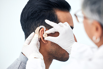 Image showing Hearing aid, deaf man and doctor hands with patient consultation for ear and ENT check at hospital. Help, employee and medical test of physician with health insurance and consulting exam with expert