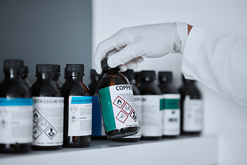 Image showing Scientist, bottle and copper in chemistry lab on shelf for pharma, analysis and medicine development. Science person, gloves and study with medical research for pharmaceutical industry innovation