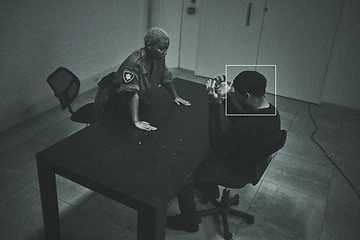 Image showing Surveillance, dark and police with a criminal in a room for interrogation, search or talking together. Serious, law and a black woman or safety officer working with a man after crime for a confession