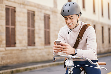 Image showing Student man, bicycle and street with phone, thinking and typing on app for blog in city for college in summer. Young guy, retro bike and smartphone with transport on campus, road or social media chat