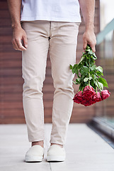 Image showing Hands, legs and man with bouquet of roses for date, romance and hope for valentines day. Love confession, romantic floral gift and person holding flowers, standing outside for proposal or engagement