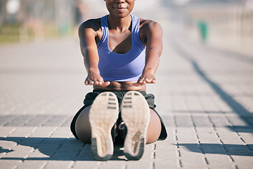 Image showing Sports woman, legs and stretching to touch feet for fitness, training and performance on urban ground. Shoes, female athlete and warm up for workout, muscle mobility and flexible exercise of runner