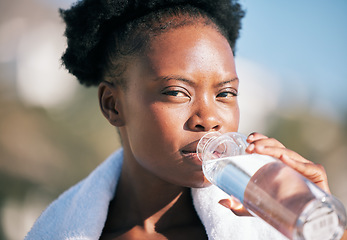 Image showing Face of black woman and drinking water for sports break, energy and workout, training and diet. Portrait of thirsty female athlete, bottle and nutrition for hydration, exercise and recovery of runner