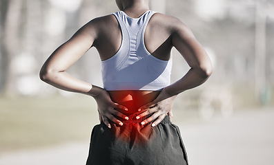 Image showing Runner woman, back pain and street with hands, emergency and problem with spine, muscle and training. Girl, running injury and accident with red glow on skin at workout, outdoor exercise and fitness