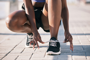 Image showing Hands, city and athlete tie shoes to start workout, training and exercise outdoor. Sports, fitness and person tying laces on sneakers to prepare for cardio, running and jog for health and wellness