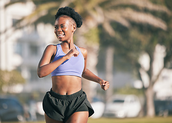 Image showing Happy, running and a black woman in the city, thinking and doing cardio in the morning. Smile, idea and an African athlete or runner in town for exercise, a workout or training for a marathon