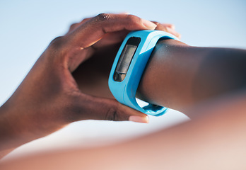 Image showing Hands, smart watch and check to monitor for steps, heart rate or speed for running, health or fitness. Person, iot clock and body info on screen with wellness, exercise or training outdoor in closeup