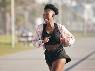 Image showing Fitness, black woman and running outdoor with music earphones for listening to radio on podcast. Sports, smile and happy African athlete training, workout and exercise for health, wellness or cardio