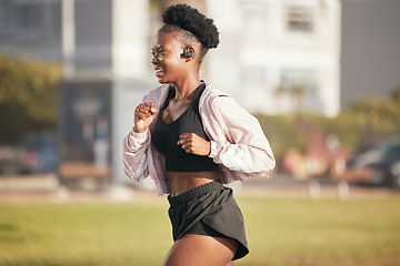 Image showing Black woman, smile and running outdoor with music earphones for listening to radio or podcast. Fitness, sports and happy African athlete training, workout and exercise for health, wellness or cardio