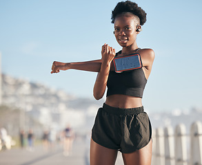 Image showing Portrait, music and stretching with a sports black woman outdoor on a blurred background for cardio or endurance training. Exercise, health or phone with a young runner getting ready for a workout