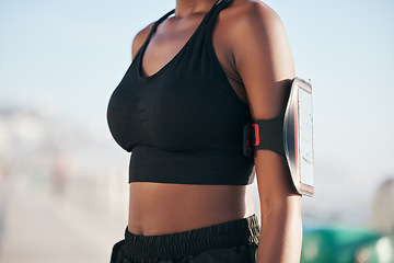 Image showing Runner woman, phone and arm in closeup for wearable tech, fitness and tracking info for exercise goals. Girl, smartphone app and armband to monitor for workout, steps and progress for healthy body