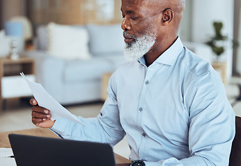 Image showing Black man, laptop or reading documents in corporate office for company finance budget, taxes audit or financial management. Mature CEO, boss or businessman with technology, paper or investment report