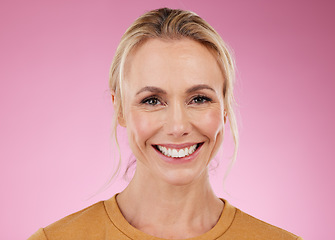 Image showing Mature woman, smile and portrait of a female model with happiness and botox in studio. Isolated, pink background and beauty of older person face feeling happy and relax with cosmetics and makeup