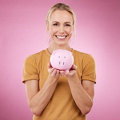 Image showing Woman, piggybank and portrait smile for savings, investment or cash money against a pink studio background. Happy female holding financial loan, profit or finance increase and salary on mockup