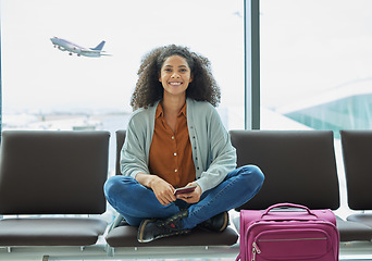 Image showing Airport, black woman and portrait of a young person at flight terminal waiting for airplane travel. Passport document, smile and sitting solo female traveler feeling happy with freedom from adventure