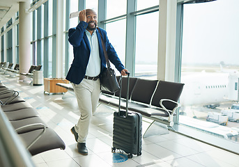 Image showing Airport, late and running black man for business flight, plane journey and travel terminal. Businessman, hurry and rush to board airplane with anxiety, stress and fast walking with suitcase luggage