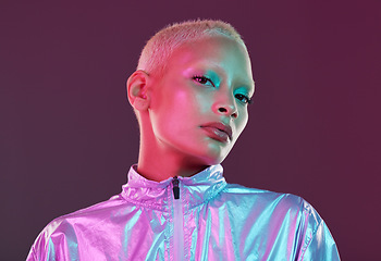 Image showing Futuristic fashion, cyberpunk portrait and black woman with chrome clothing in studio. Vaporwave, isolated and gen z with a young female model glow with cosmetics and scifi clothes with mockup