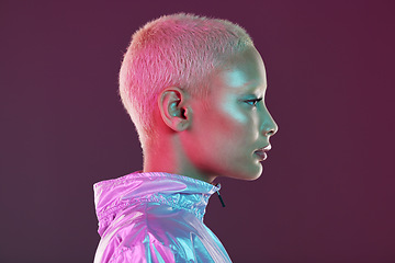 Image showing Holographic fashion, woman face and glow for hologram trend isolated on a studio background. Futuristic, vaporwave and art color jacket on cyberpunk model for retro cosmetics and makeup shine on skin