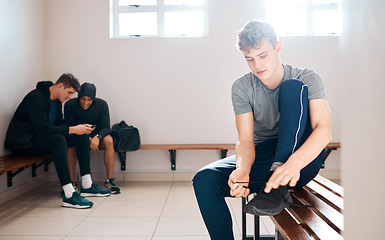 Image showing Sports, fitness and men in gym locker room tie shoes ready for practice, exercise and training. Active lifestyle, sport club and male athletes dressing preparation for workout, wellness and health