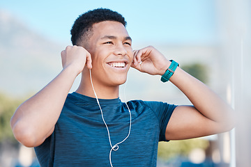 Image showing Music, fitness and man thinking of running, exercise, and workout in the city of Brazil. Motivation, ready and young runner listening to a podcast, audio or radio to start training in the morning