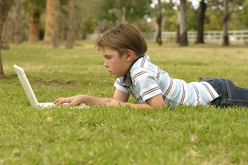 Image showing Notebook computer and boy