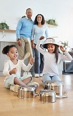 Image showing Funny, playing and children with pots for drums with parents watching with love in their home kitchen. Family, happy and crazy playful siblings making noise on metal to play a sound for mom and dad