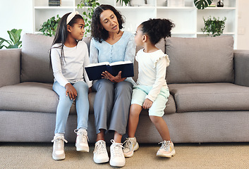 Image showing Religion, book and children or family reading, teaching and learning bible story, knowledge and education in living room. Grandmother on sofa with holy scripture, gospel or history of god for kids