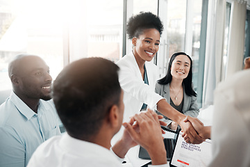 Image showing Healthcare, onboarding and handshake, doctors meeting in hospital office interview with HR recruitment agent. Diversity, human resources and black woman doctor shaking hands in welcome or thank you.