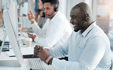 Image showing Success, consulting and call center with black man at computer for deal, customer service and telemarketing. Happy, winner and target with consultant in office for technical support, sales and goals