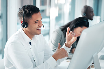 Image showing Telemarketing, man and talking in office, call center and explain system, process and deadline. Male employee, agent and happy consultant with headset, customer service and tech support in workplace