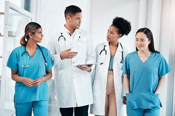 Image showing Doctor team tablet, hospital conversation and healthcare staff communication with data. Teamwork, nurse collaboration and doctors in a wellness and health clinic with nurses discussion and diversity