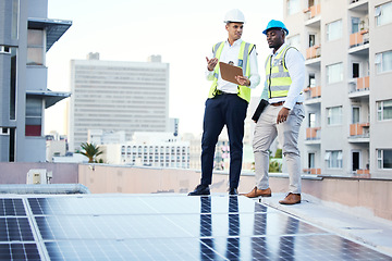 Image showing Solar panels, rooftop and engineering people in energy saving, urban sustainability and city installation teamwork. Inspection, checklist and technician men planning sustainable power solution