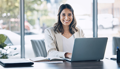 Image showing Lawyer, portrait and laptop in office planning, legal consulting or policy review feedback in corporate law firm. Smile, happy and attorney woman on technology in case research or schedule management