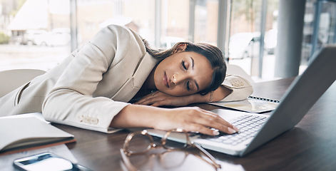 Image showing Sleeping, laptop and business woman in office for exhausted, tired and overworked. Burnout, fatigue and lazy with employee napping at desk for stress, mental health and headache rest from pressure