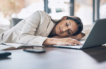 Image showing Sleeping, tired and business woman at laptop in office for exhausted, dreaming and overworked. Burnout, fatigue and lazy with employee napping at desk for stress, mental health and headache rest