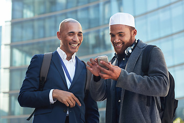 Image showing Phone, city and diversity business men for global networking, social media update and corporate collaboration. Happy black man with Arab, muslim or islamic partner on smartphone of international chat