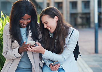 Image showing Cellphone, women and friends in the city on holiday, adventure or weekend trip with 5g network. Happy, friendship and interracial females browsing on social media, mobile app and internet on a phone.