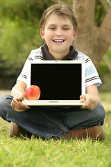 Image showing Child Holding Laptop