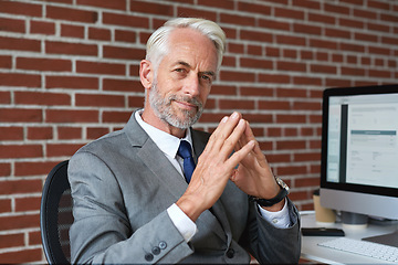 Image showing Executive, senior and portrait of a businessman at a workspace with confidence and experience. Corporate, success and elderly ceo or manager working to success in an office while smiling for job